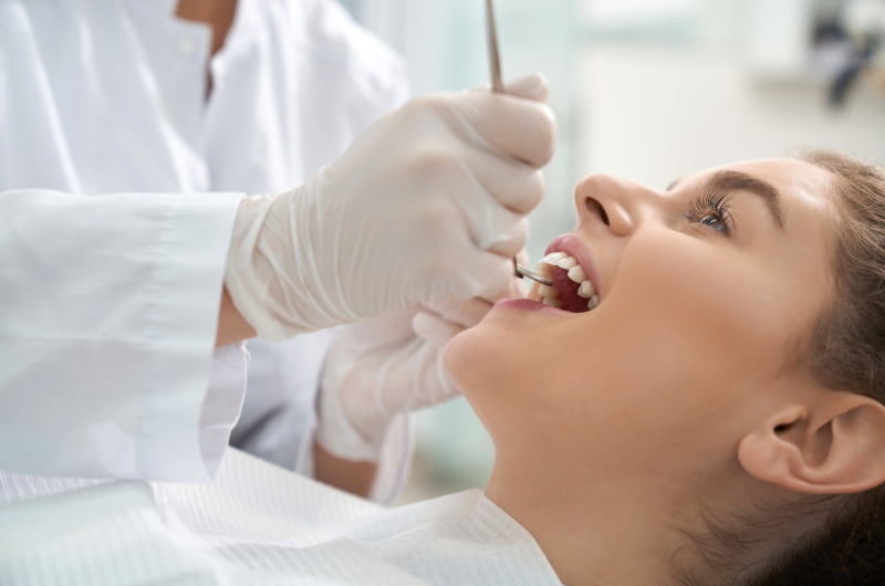 Patient receiving modern full-arch dental implant treatment at a dental clinic