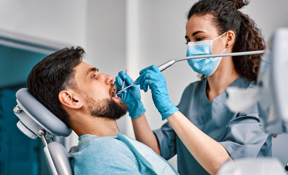 Dental professional performing a professional teeth cleaning