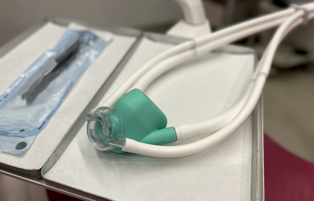 Dentist preparing patient for sedation dentistry procedure